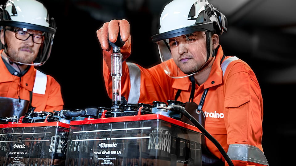 technicians-testing-industrial-batteries